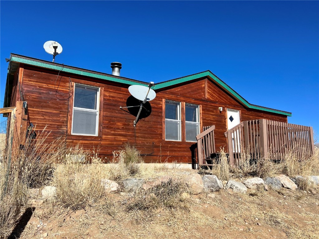 7429 Remington Road Como, CO 80432 - Photo 1 of 21 a front view of house with yard