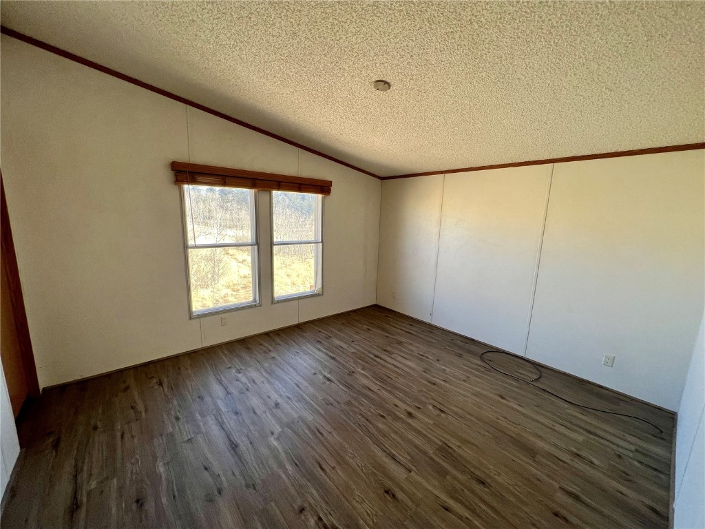 7429 Remington Road Como, CO 80432 - Photo 11 of 21 an empty room with wooden floor and windows