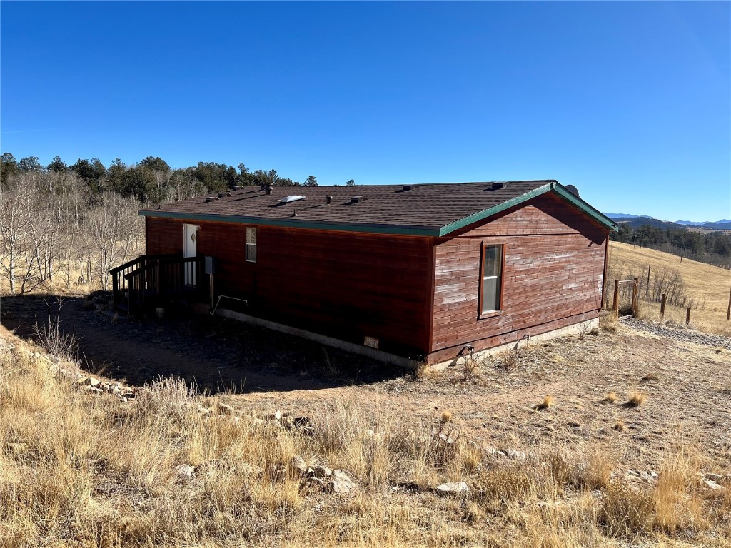 7429 Remington Road Como, CO 80432 - Photo 18 of 21 a view of a house with a yard