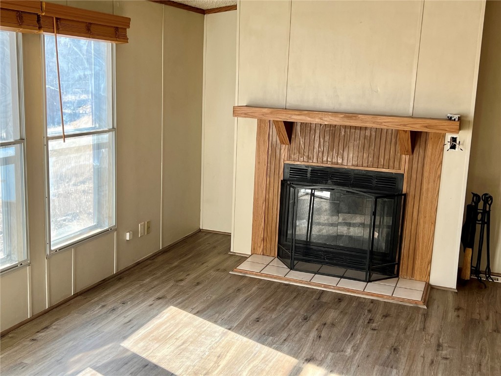 7429 Remington Road Como, CO 80432 - Photo 10 of 21 a view of an empty room with wooden floor fireplace and a window