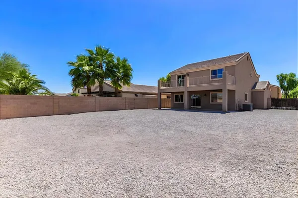 a view of a house with a yard and a garage