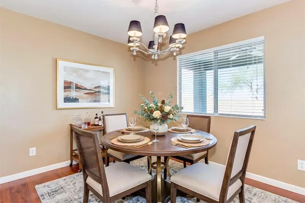 a view of a dining room with furniture window and wooden floor
