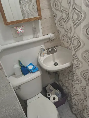 a bathroom with a sink and toilet