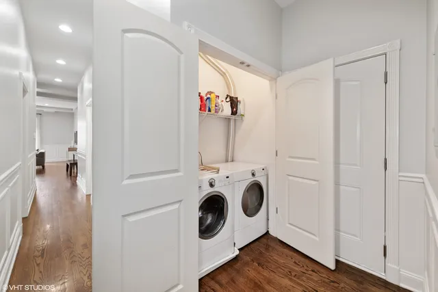 a view of a hallway with washer and dryer