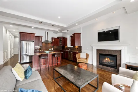 a living room with furniture fireplace and flat screen tv