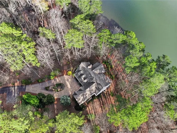 an aerial view of a house with a yard