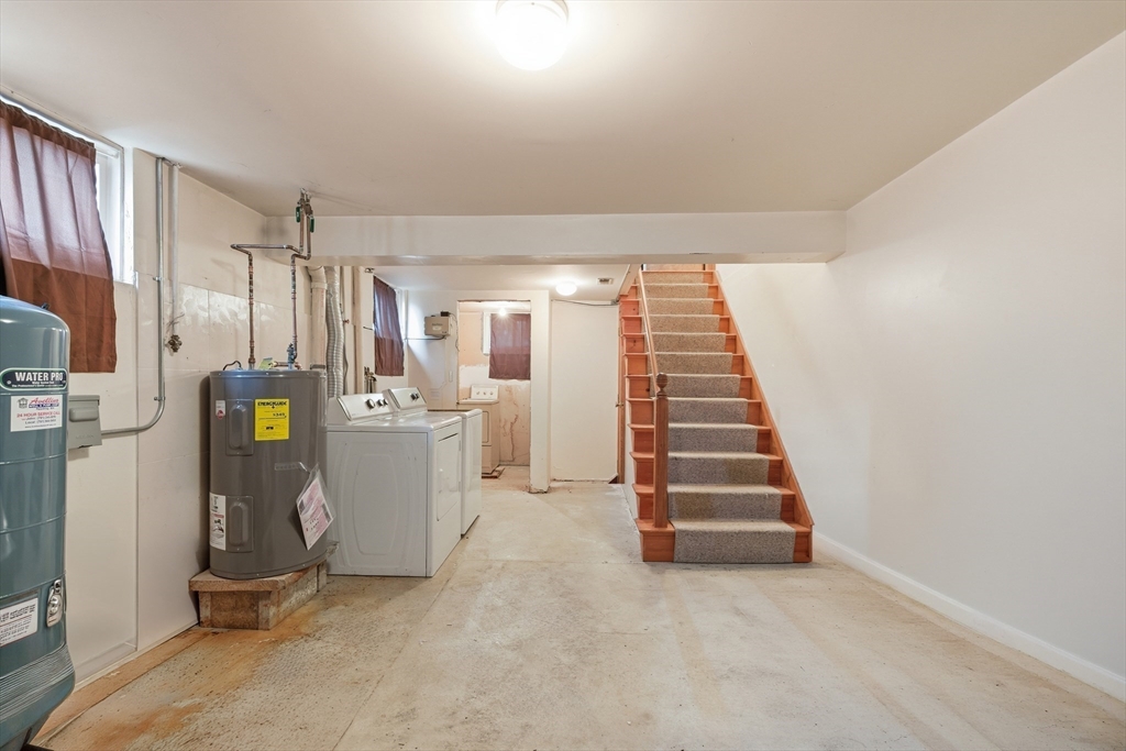 4-6 Jensen Road, Unit 6 Watertown, MA 02472 - Photo 19 of 23 a view of a room with stairs and children