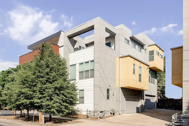a view of a white building among the street