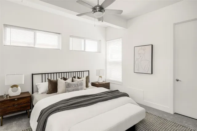 a bedroom with a bed and window