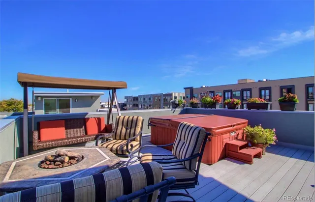 a outdoor space with furniture and a fireplace