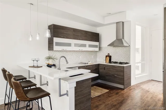 a kitchen with stainless steel appliances a sink and a stove