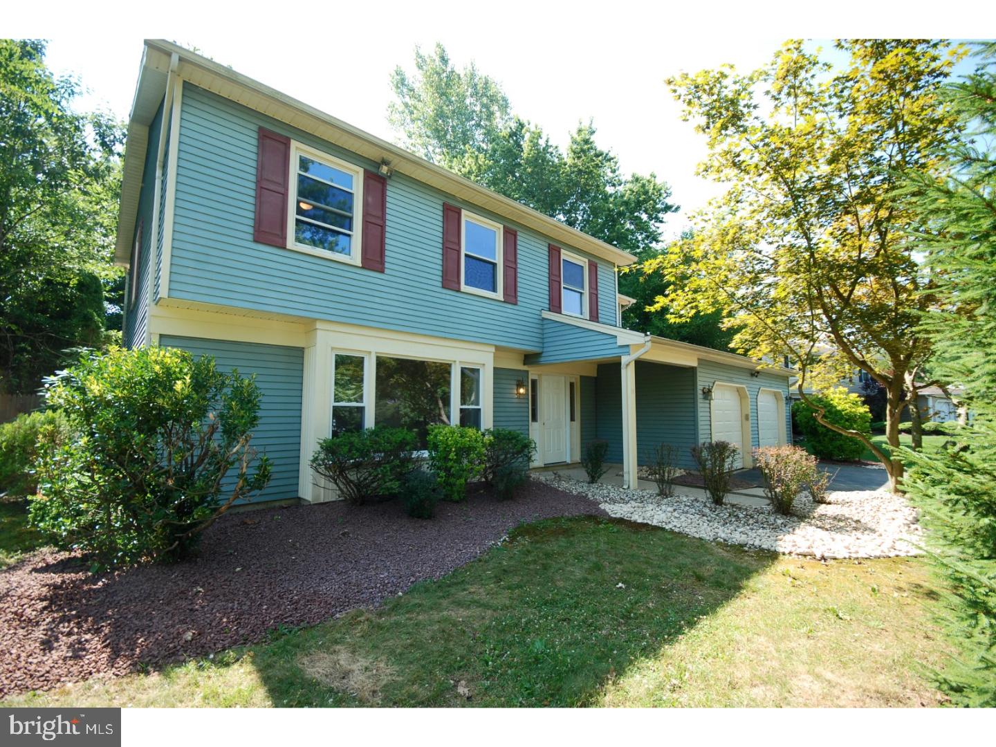 39 Lexington Road Freehold, NJ 07728 - Photo 1 of 24 a front view of a house with garden