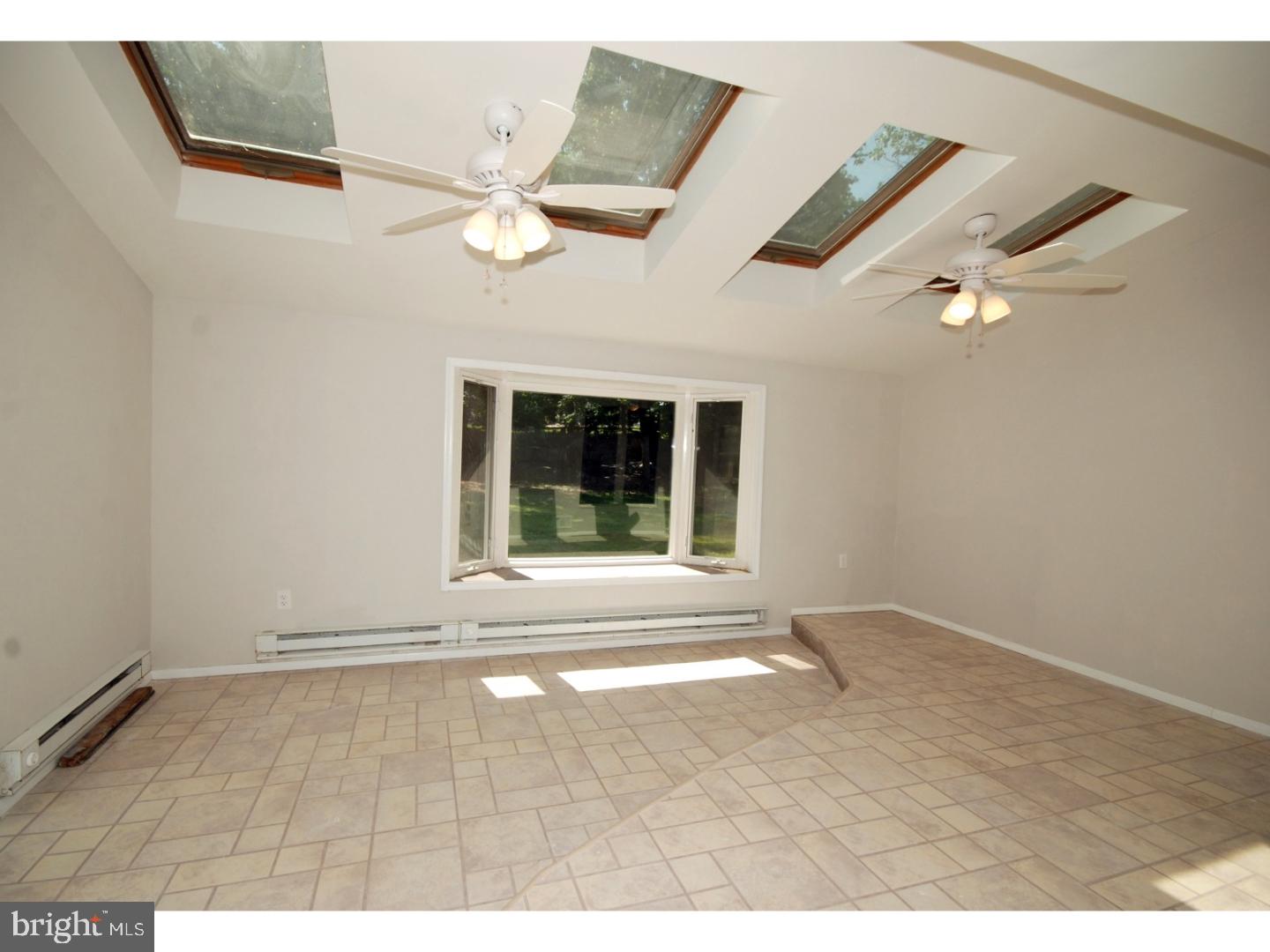 39 Lexington Road Freehold, NJ 07728 - Photo 5 of 24 a view of an empty room with a window