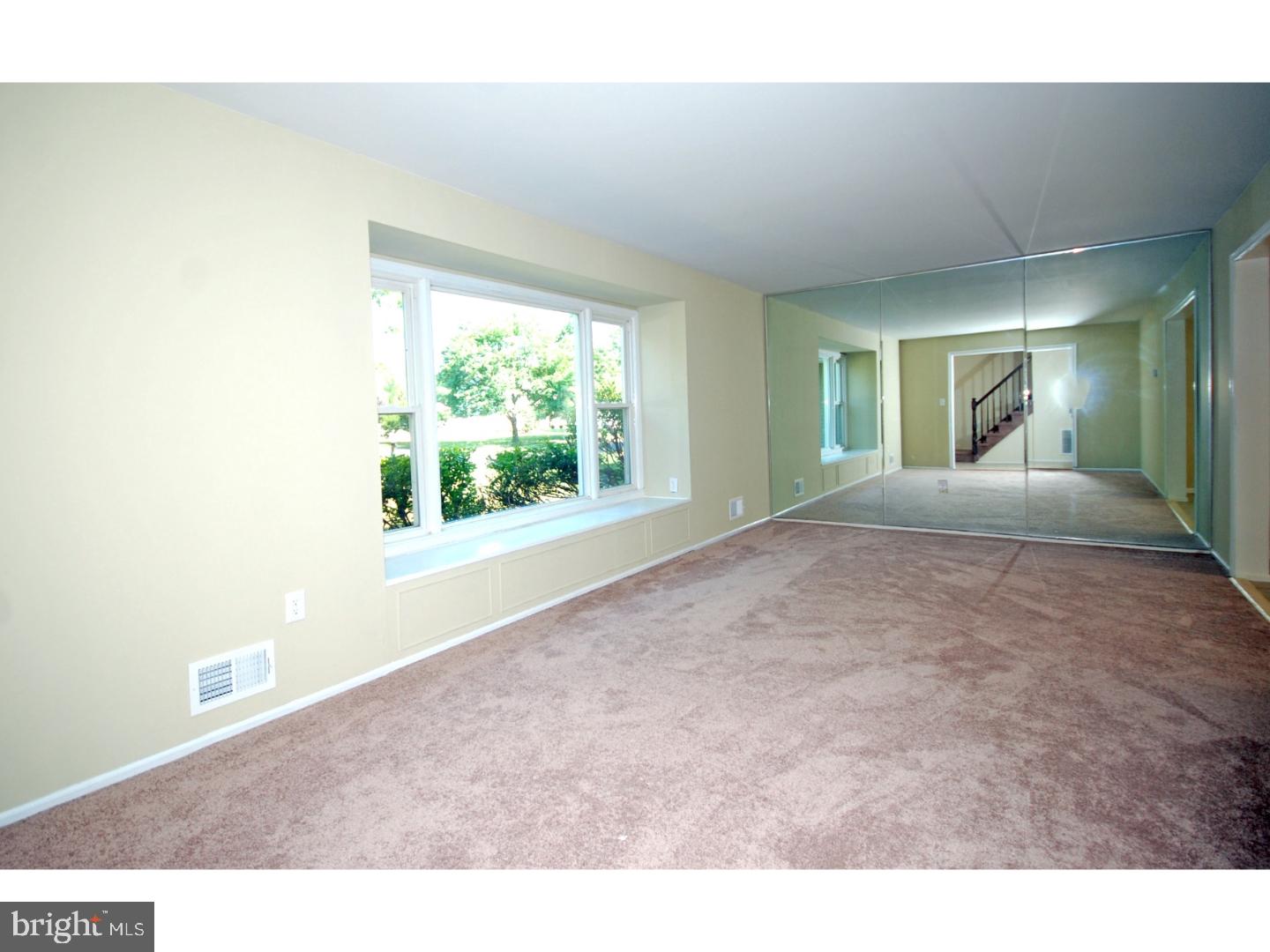 39 Lexington Road Freehold, NJ 07728 - Photo 9 of 24 a view of a room that has a window