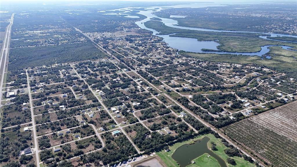 29359 Nottingham Road Punta Gorda, FL 33982 - Photo 7 of 20 an aerial view of residential houses with outdoor space