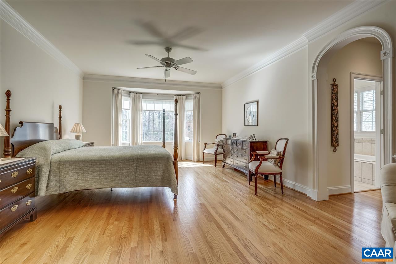 3470 Darby Road Keswick, VA 22947 - Photo 25 of 50 a bedroom with a bed and wooden floor