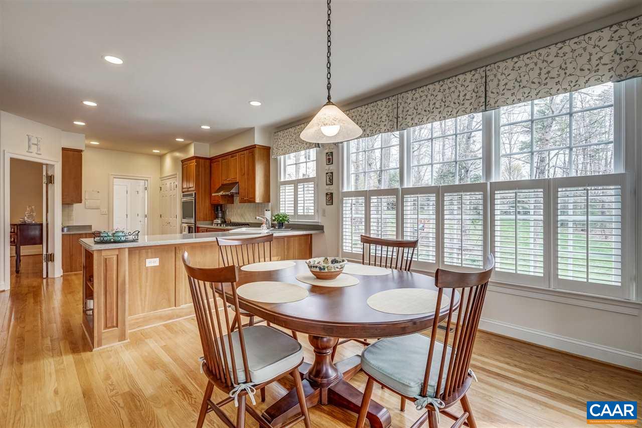 3470 Darby Road Keswick, VA 22947 - Photo 34 of 50 a dining room with stainless steel appliances granite countertop a table and chairs