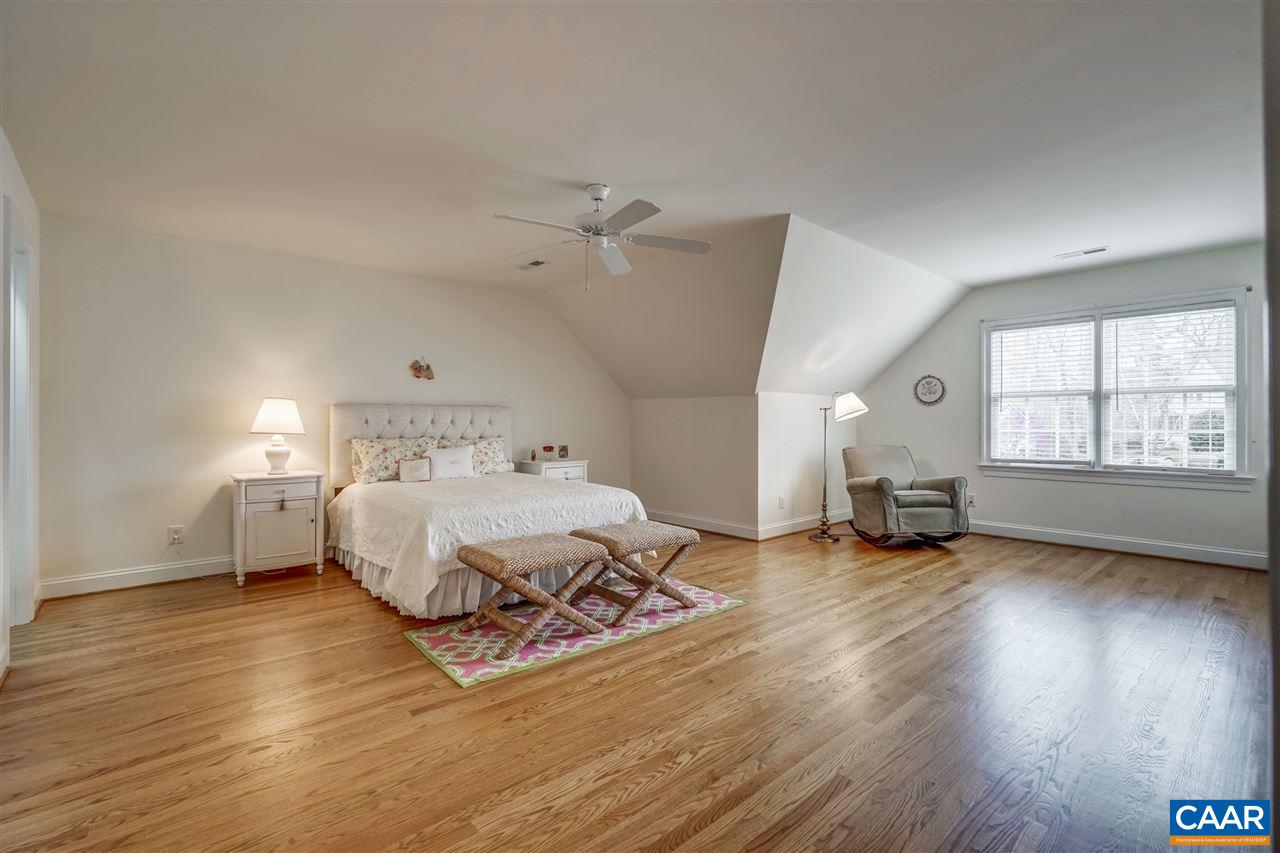 3470 Darby Road Keswick, VA 22947 - Photo 44 of 50 a spacious bedroom with a bed and a window