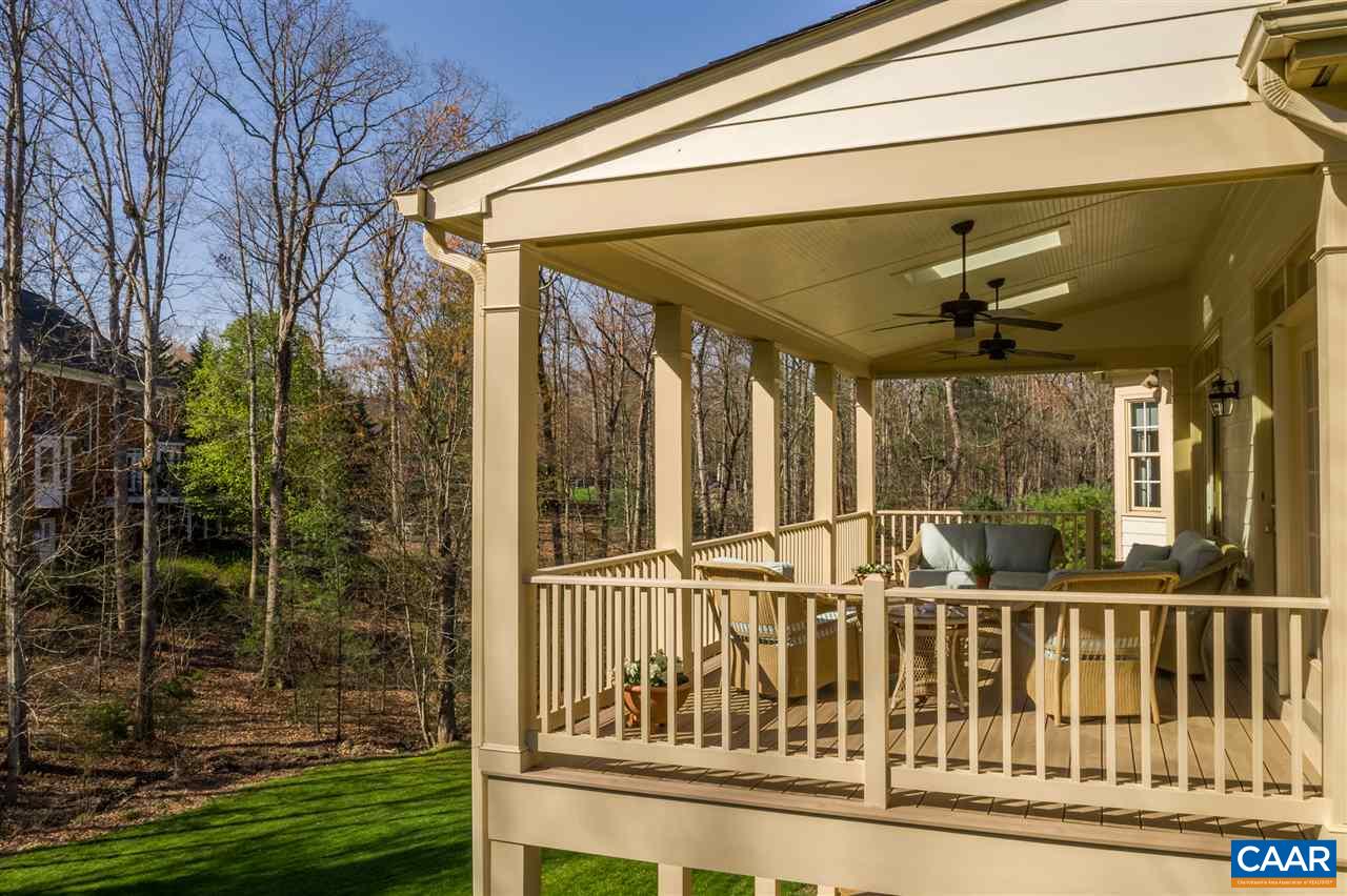 3470 Darby Road Keswick, VA 22947 - Photo 8 of 50 a view of a porch with a floor to ceiling window and yard