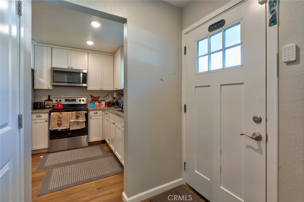 1840 Cheyenne Drive Merced, CA 95348 - Photo 11 of 90 a kitchen with granite countertop white cabinets and stainless steel appliances