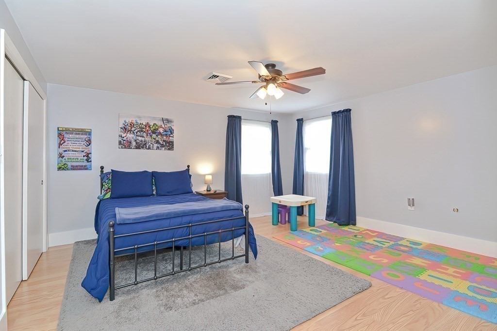 39 Dolan Road Millbury, MA 01527 - Photo 12 of 27 a bedroom with a bed table and a window