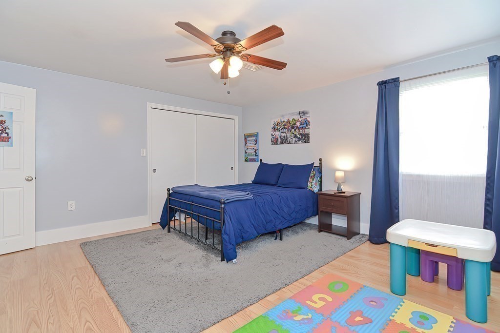 39 Dolan Road Millbury, MA 01527 - Photo 14 of 27 a bedroom with a bed and a table in it