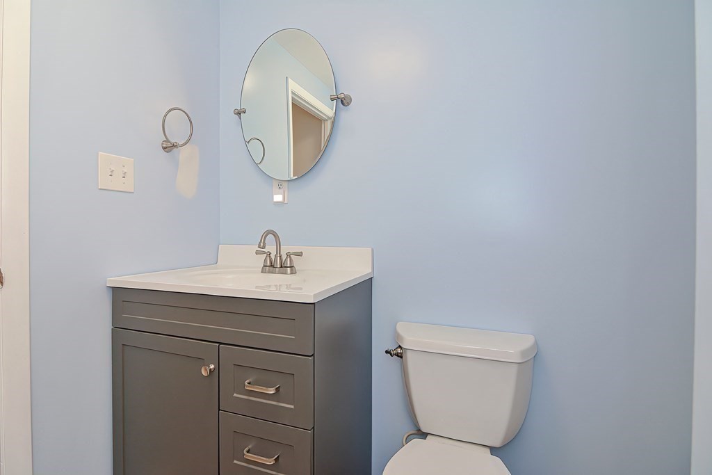 39 Dolan Road Millbury, MA 01527 - Photo 18 of 27 a bathroom with a toilet sink and mirror