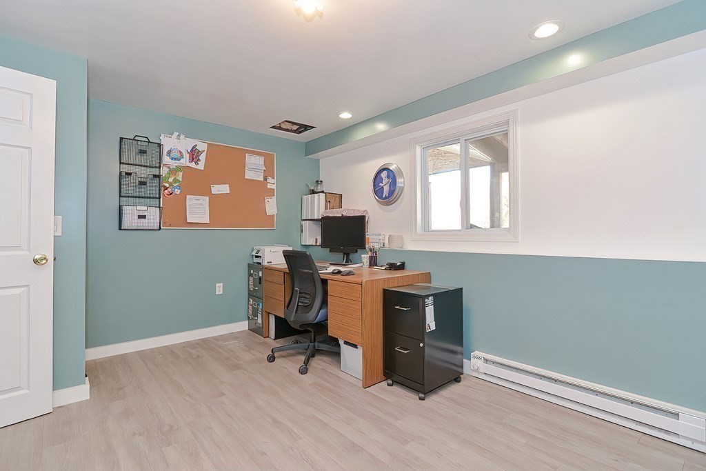 39 Dolan Road Millbury, MA 01527 - Photo 20 of 27 a view of a workspace with furniture and a window