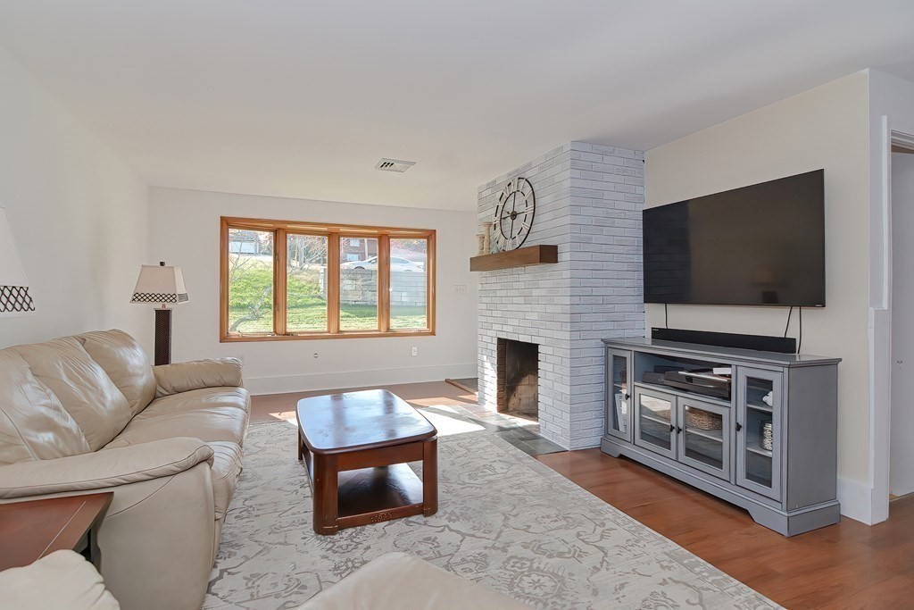 39 Dolan Road Millbury, MA 01527 - Photo 4 of 27 a living room with furniture and a flat screen tv