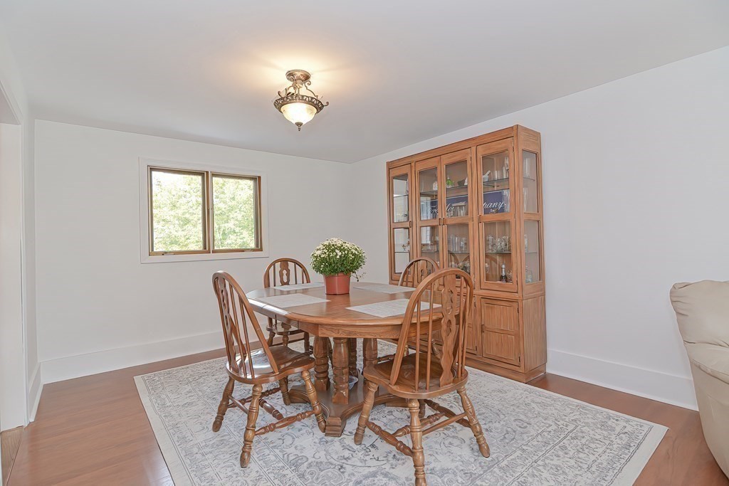 39 Dolan Road Millbury, MA 01527 - Photo 7 of 27 a view of a dining room with furniture and wooden floor