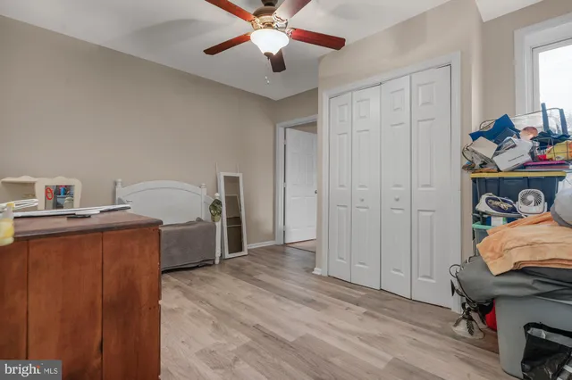 a bed room with a bed and a television