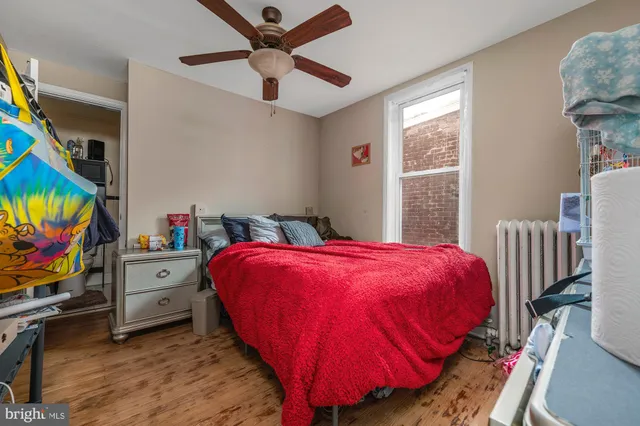 a bed room with a bed and a tv