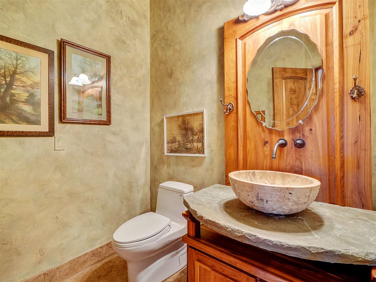 966 Mesa Drive Rifle, CO 81650 - Photo 17 of 31 a bathroom with a granite countertop toilet sink and mirror