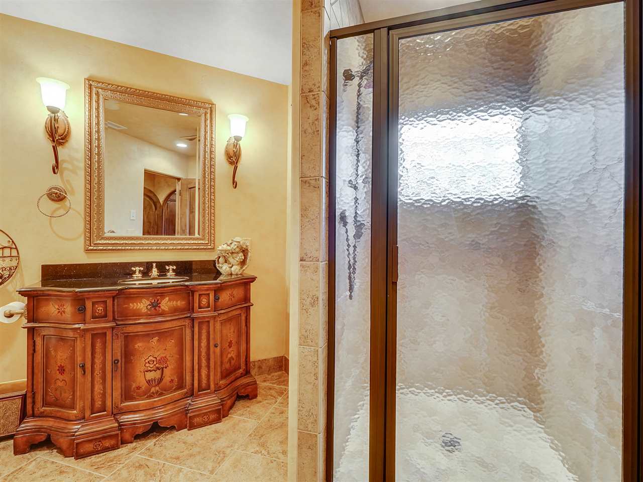 966 Mesa Drive Rifle, CO 81650 - Photo 21 of 31 a bathroom with a sink a mirror and a shower