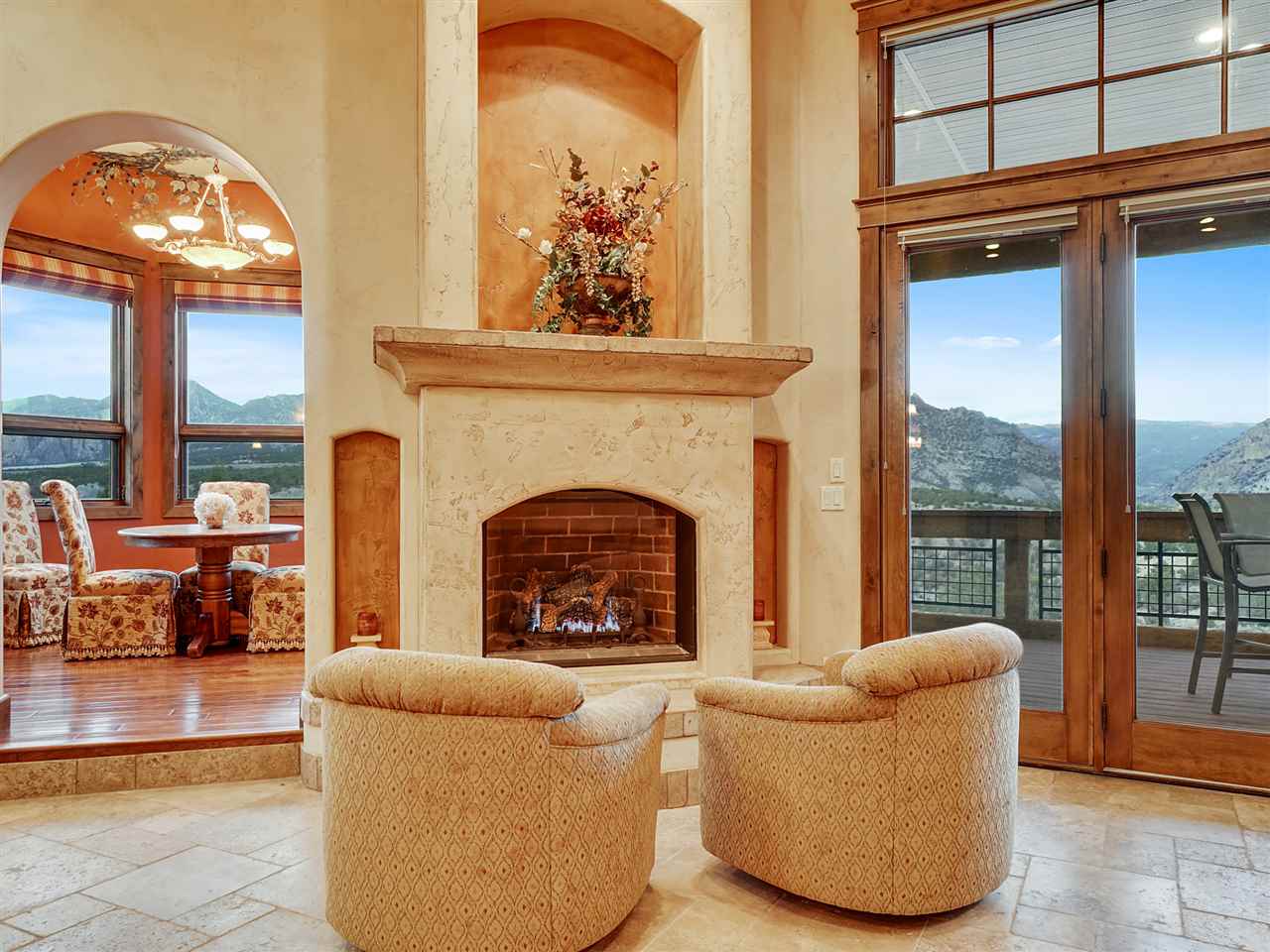 966 Mesa Drive Rifle, CO 81650 - Photo 3 of 31 a living room with furniture a large window and a fireplace