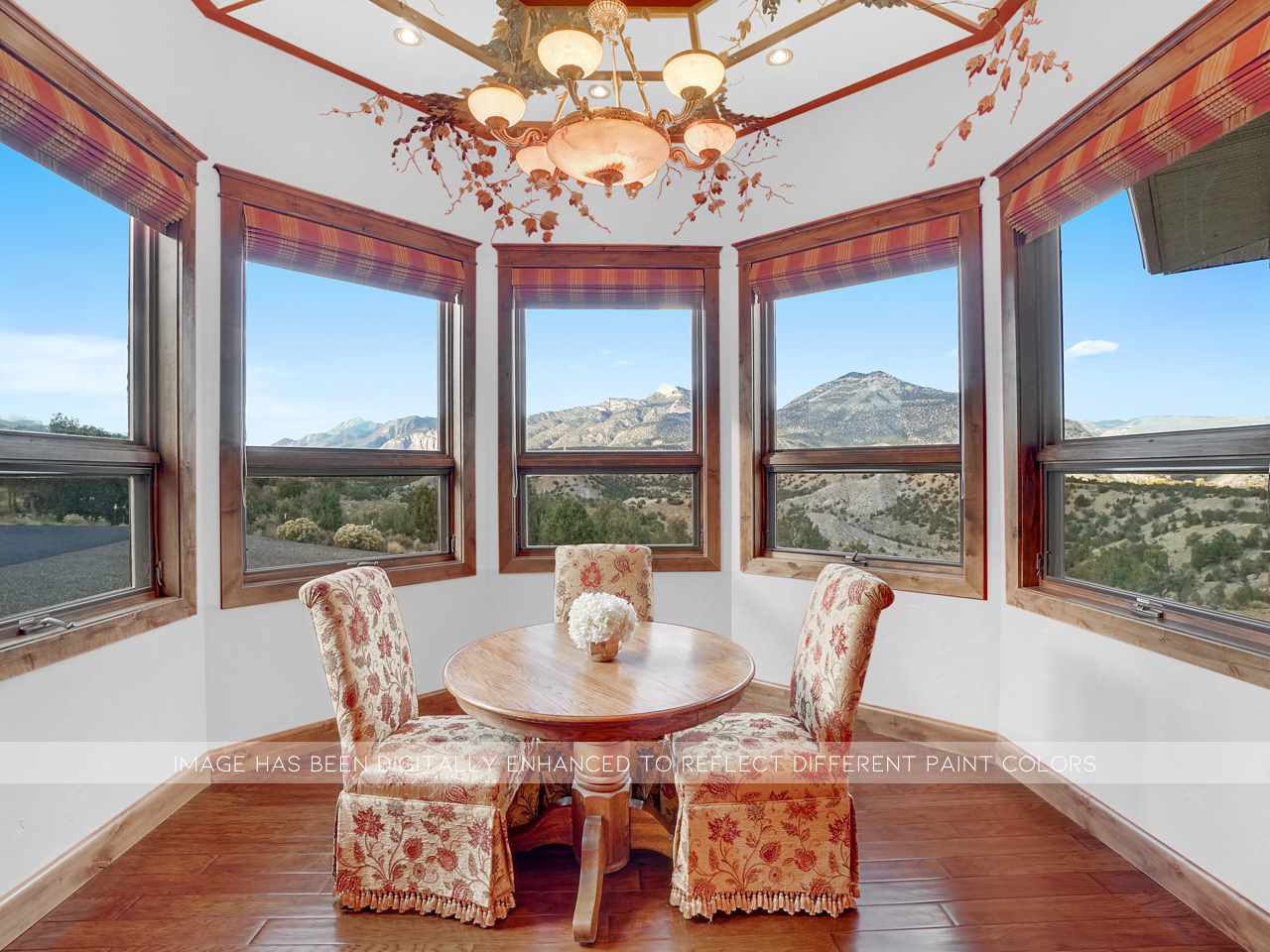 966 Mesa Drive Rifle, CO 81650 - Photo 8 of 31 a dining room with furniture a chandelier and wooden floor