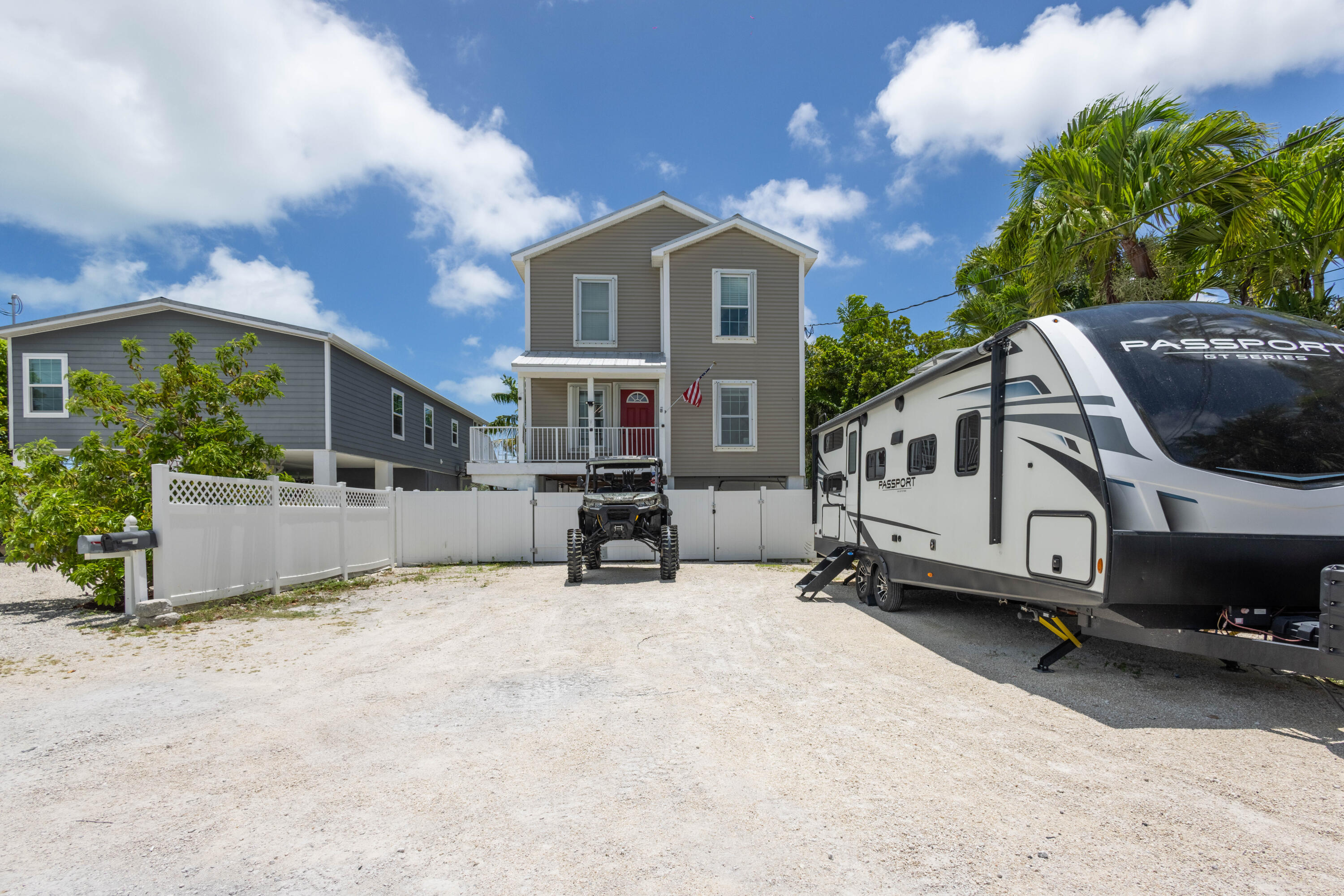 a view of a house with a yard and sitting area