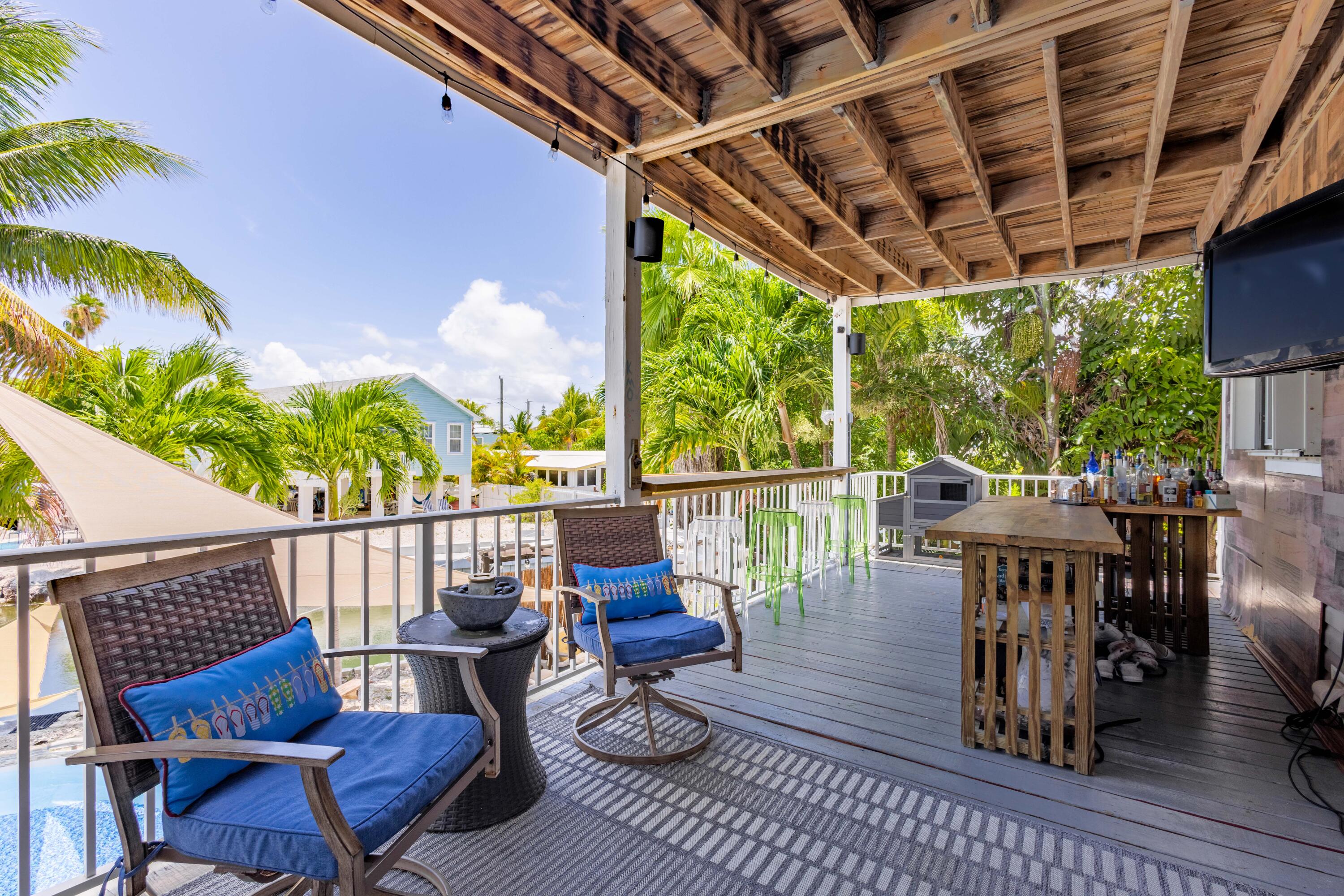255 Mars Lane Key West, FL 33040 - Photo 16 of 43 a view of a chairs and table in patio