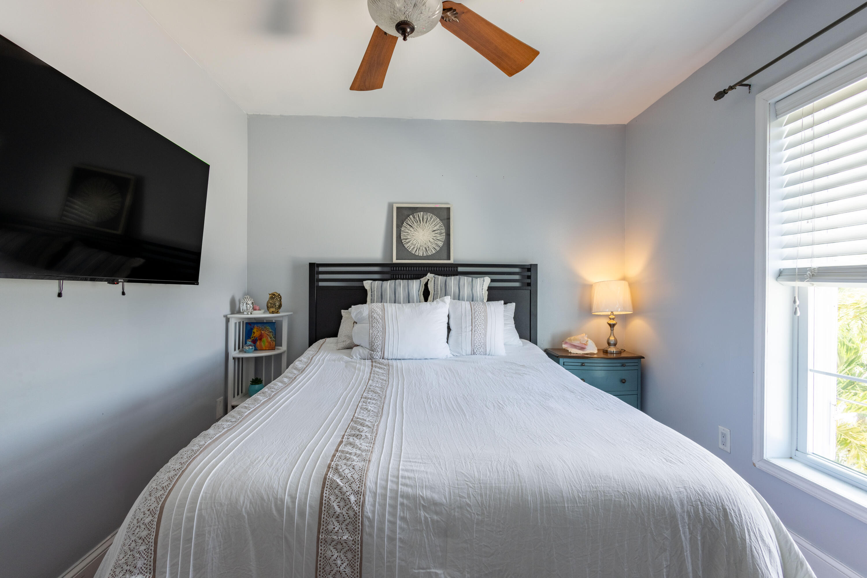 255 Mars Lane Key West, FL 33040 - Photo 20 of 43 a bedroom with a bed and a flat screen tv