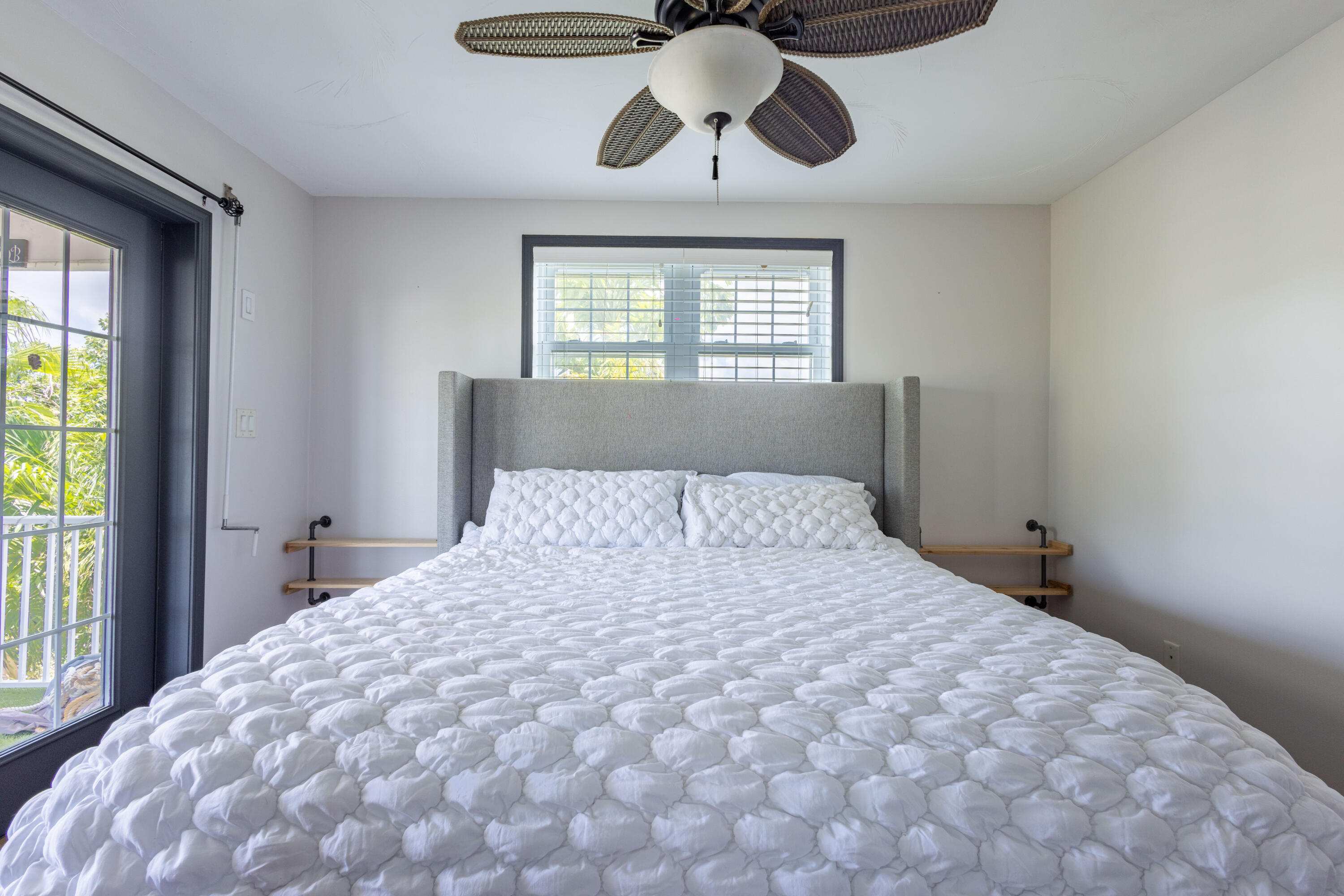 255 Mars Lane Key West, FL 33040 - Photo 24 of 43 a bedroom with a bed and window