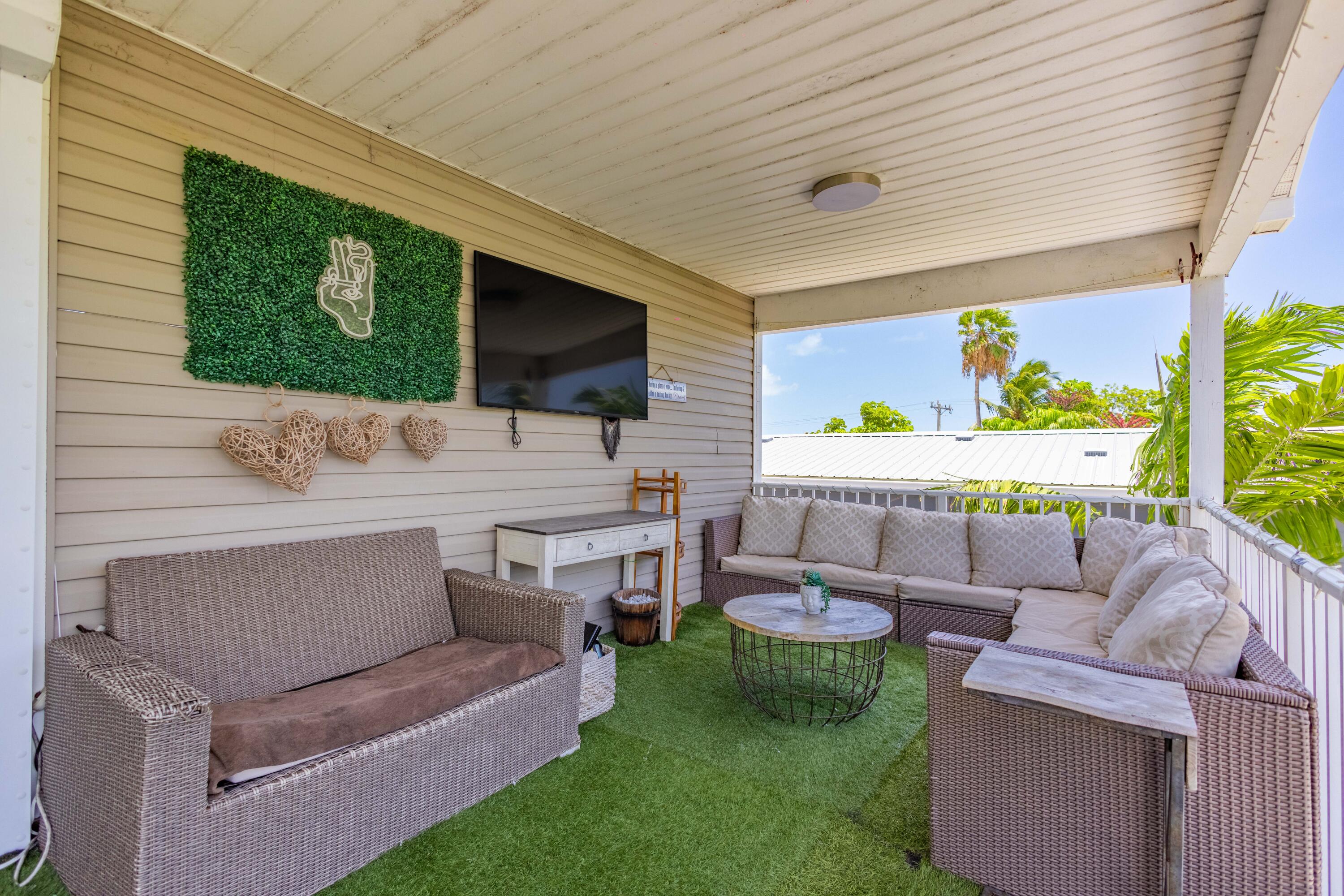 255 Mars Lane Key West, FL 33040 - Photo 28 of 43 a building outdoor space with patio furniture