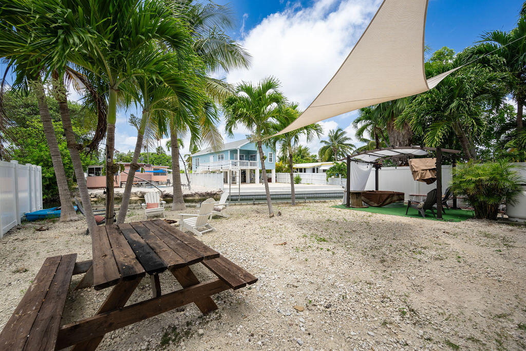 255 Mars Lane Key West, FL 33040 - Photo 34 of 43 a view of a backyard with sitting area