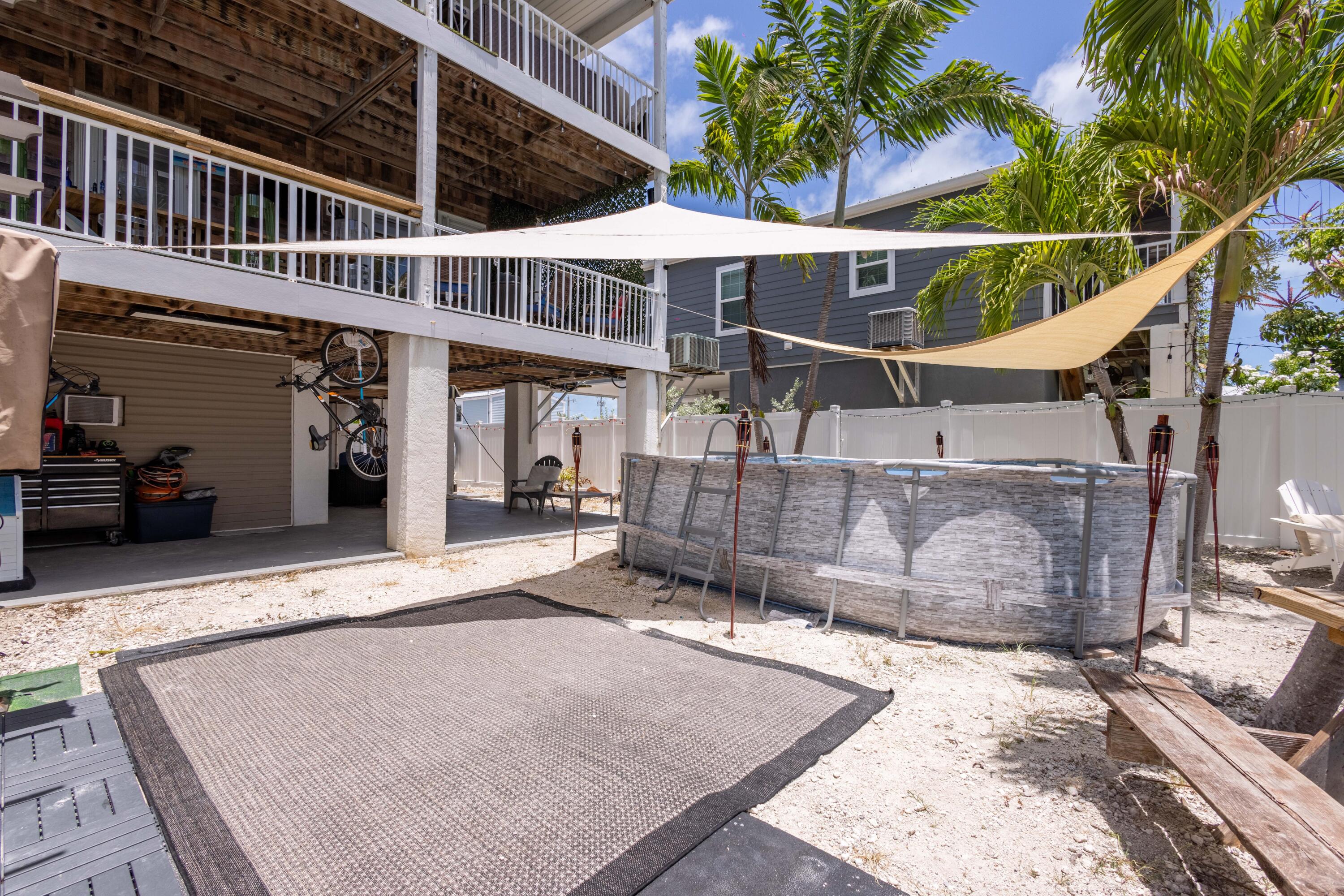 255 Mars Lane Key West, FL 33040 - Photo 35 of 43 a view of a house with a wooden deck