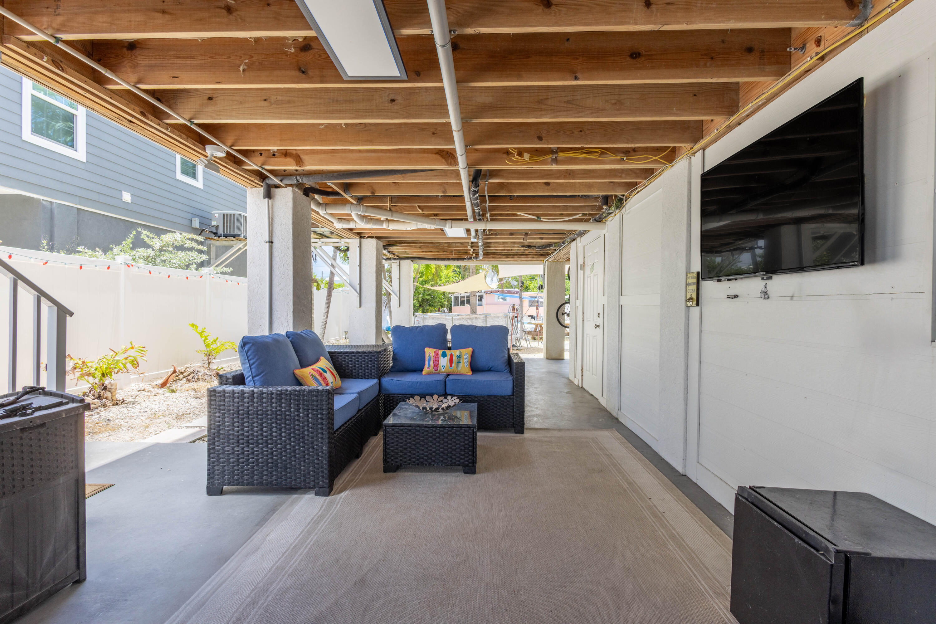 255 Mars Lane Key West, FL 33040 - Photo 38 of 43 a view of living room filled with furniture and a flat screen tv