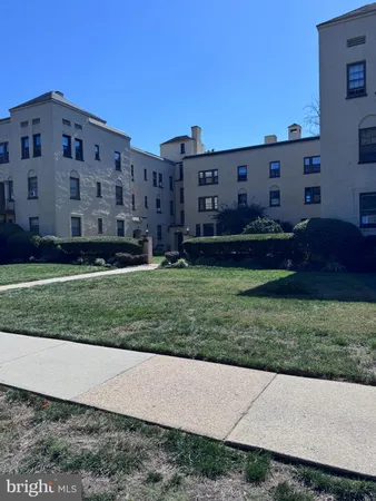 a view of a building with a yard