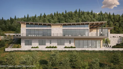 a front view of a house with a yard fountain and outdoor seating