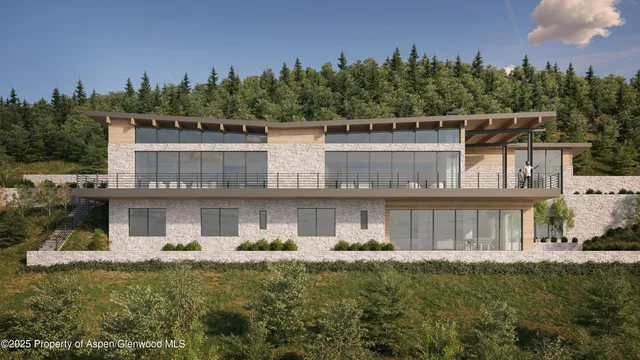 a front view of a house with a yard fountain and outdoor seating