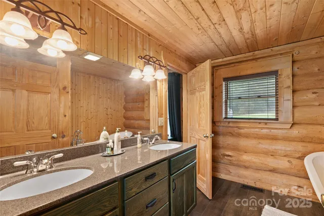a bathroom with a double vanity sink and a mirror