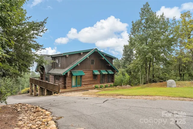 a house view with a swimming pool and porch