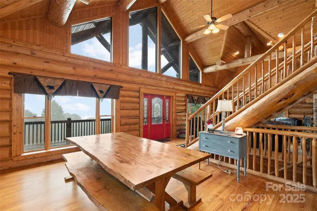 a balcony with table and chairs